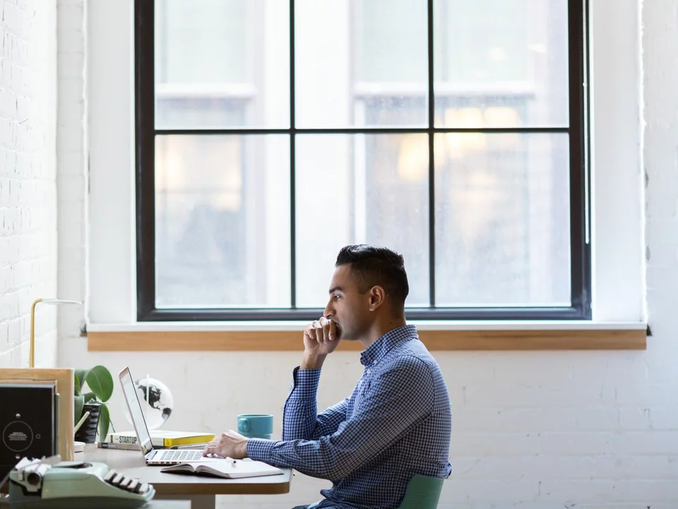 Professional choosing between remote job opportunities